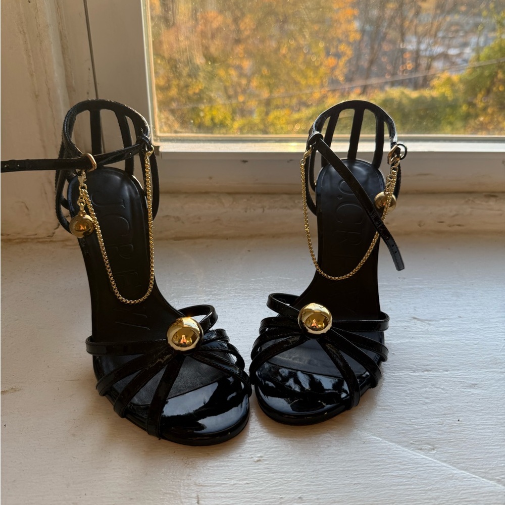 Elegant Black Strappy Heels with Gold Accents